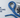 Blue double braid rope formed into a spliced eye around a stainless steel thimble, laid out with a splicing fid, whipping twine, tape measure and knife